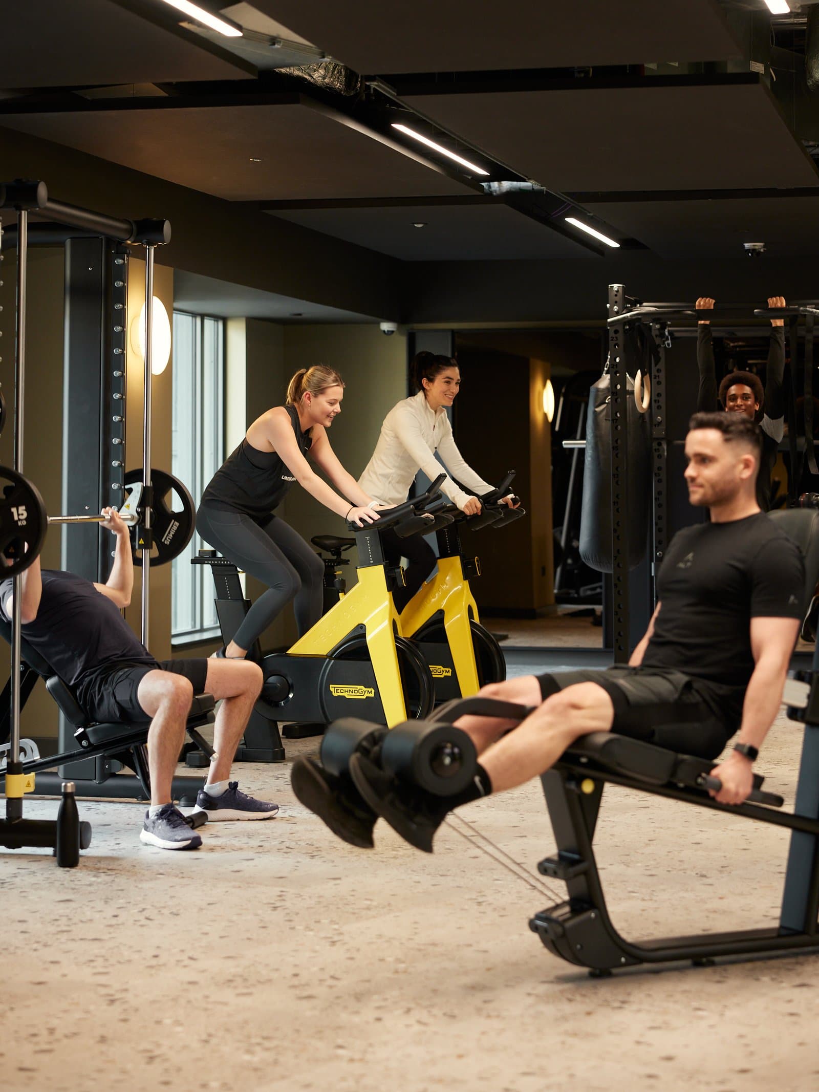 Residents training together on the gym floor at one of our buildings